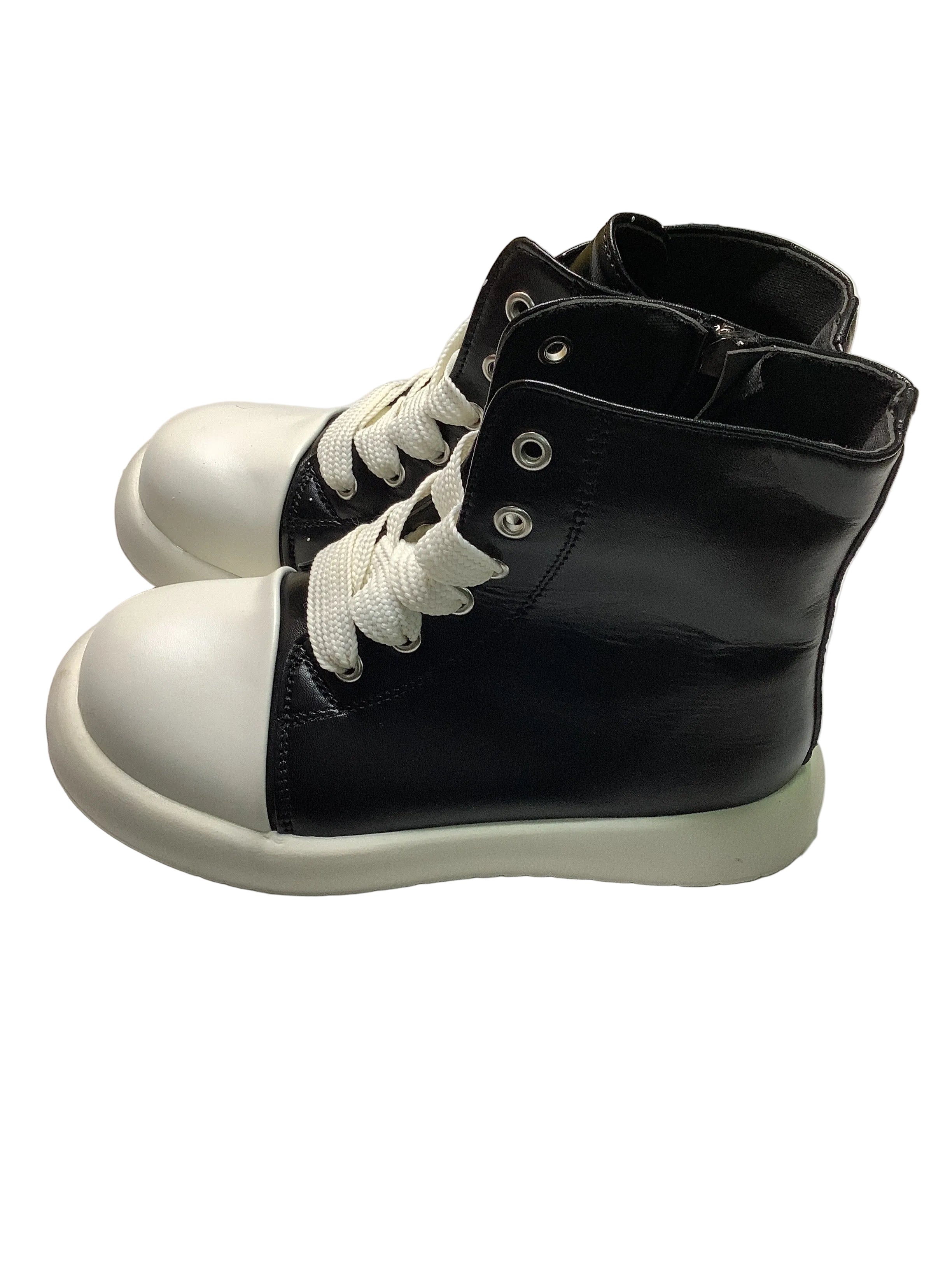High Top Boots With White Sole.